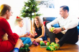 Family christmas time, people wearing christmas socks, christmas balls by Rainbow Socks