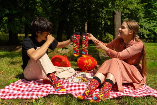 man and woman wearing national socks Asia, ideal gift for fan of travelling