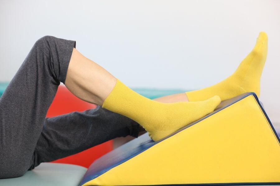 Yellow socks – non-binding socks, a person lying down. 