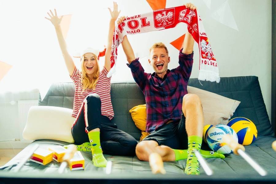 Themed Party Socks – couple of football fans cheering for Poland in their football socks.