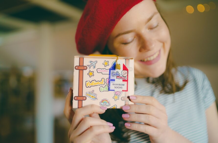 Woman holding national socks box France,  a gift for women